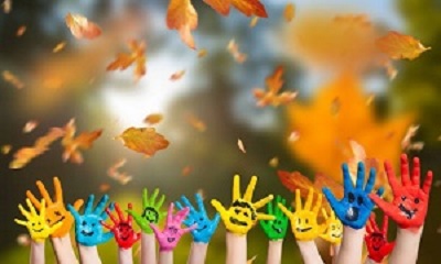 Children's hands with autumn leaves